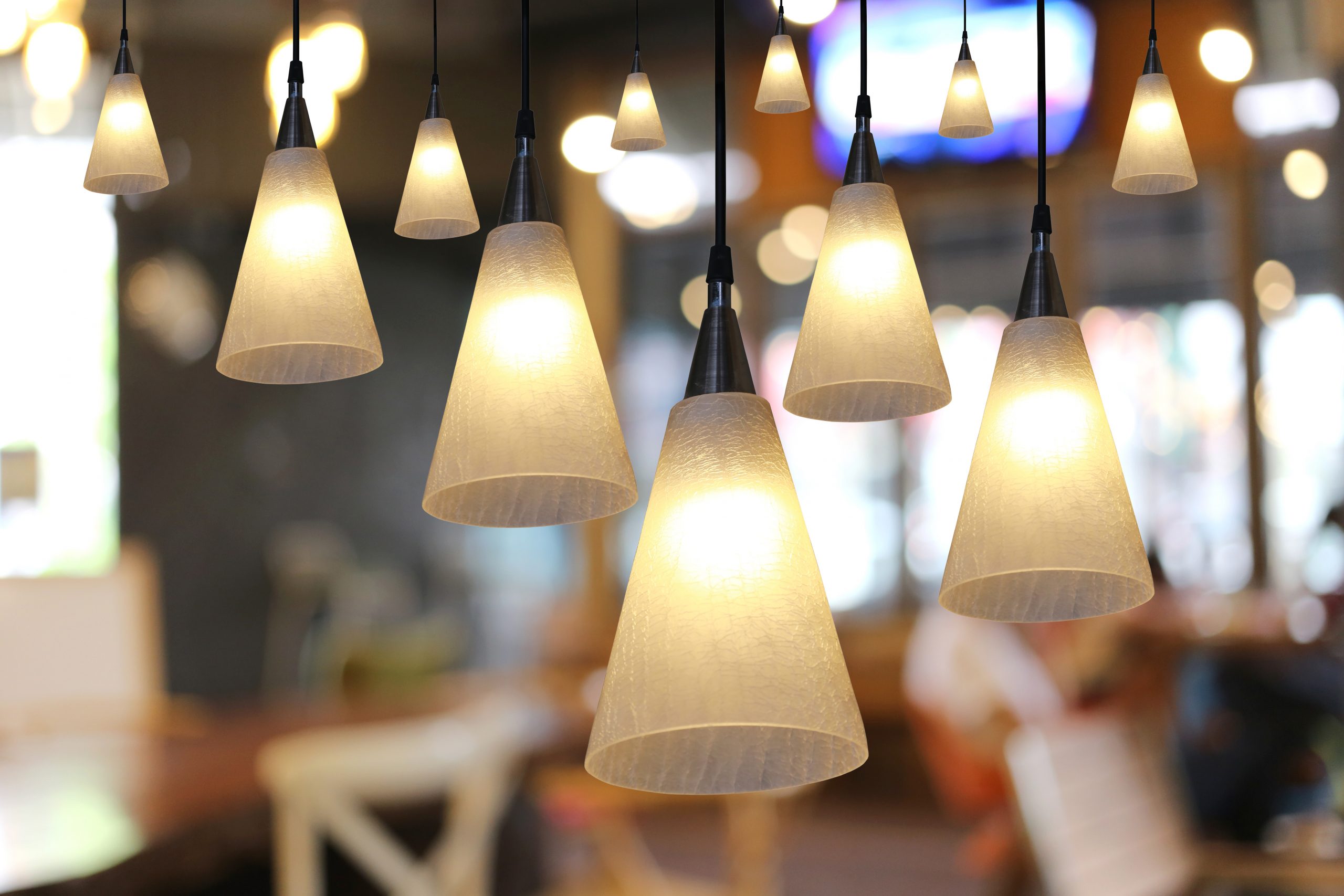 Warm lighting modern ceiling lamps in the cafe and interior decoration restaurant.